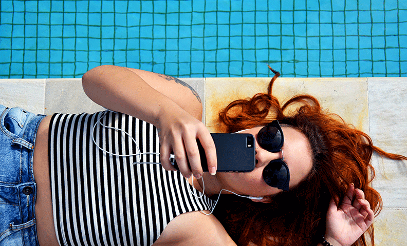 Girl taking selfie by pool